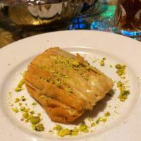 Baklava · Middle Eastern delicacy. Flaky phyllo dough with clarified butter and stuffed with nuts and ...
