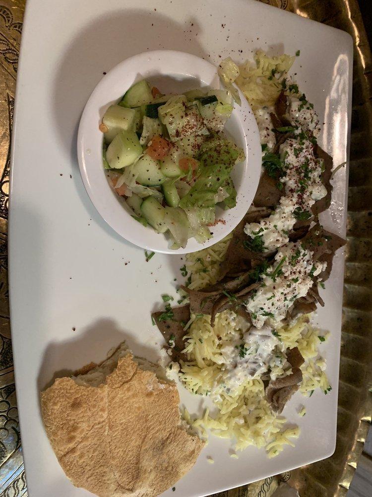 Gyro Plate · Juicy pieces of mixed lamb and beef gyro strips accompanied with tzatziki dip, served with petra salad, basmati rice and drizzled with our homemade petra sauce. Served with homemade hot pita bread.