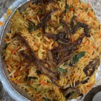 Chicken Biryani · Long grained basmati rice, cooked with succulent pieces of chicken and blended with exotic I...