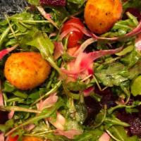 Goat Cheese Salad · Arugula, baby beets, goat cheese fritters, and light tangerine dressing.