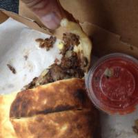 Philly Calzone · Green peppers, steak, mushrooms, onions, and cheddar cheese.