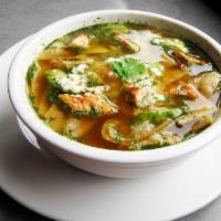 Chicken Tortilla Soup · A Mexican soup with grilled chicken, crisp tortilla strips, avocado, Mexican rice and Cotija...