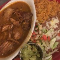 Pork Carnitas · Traditionally slow cooked pork loin prepared with garlic and topped with a mild red sauce. S...