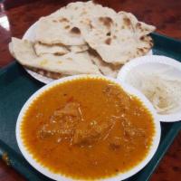 Butter Chicken · Clay oven cooked dark meat simmered in a tomato and onion sauce.