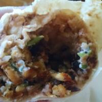 Regular Burrito · Choice of meat, rice, beans, onions, cilantro, sour cream, salsa.