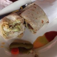 Chile Relleno Burrito · Chile Relleno, rice, beans, onions, cilantro, lettuce, guacamole, sour cream, monterey jack ...