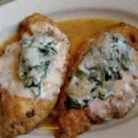 Chicken Florentine · Egg dipped chicken breast, sauteed in creamy lemon butter, and white wine sauce, topped with...