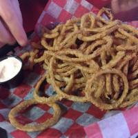 Onion Straws · Freshly sliced onions battered and fried to perfection. Comes with horseradish sour cream.