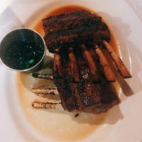 New Zealand Rack of Lamb · A 14 oz. rack of lamb marinated with thyme, rosemary and garlic and served with mint jelly.