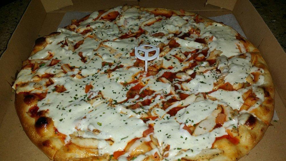 Thai Chili Pizza · Thai chili base with grilled chicken, tomatoes, mozzarella and drizzled ranch.