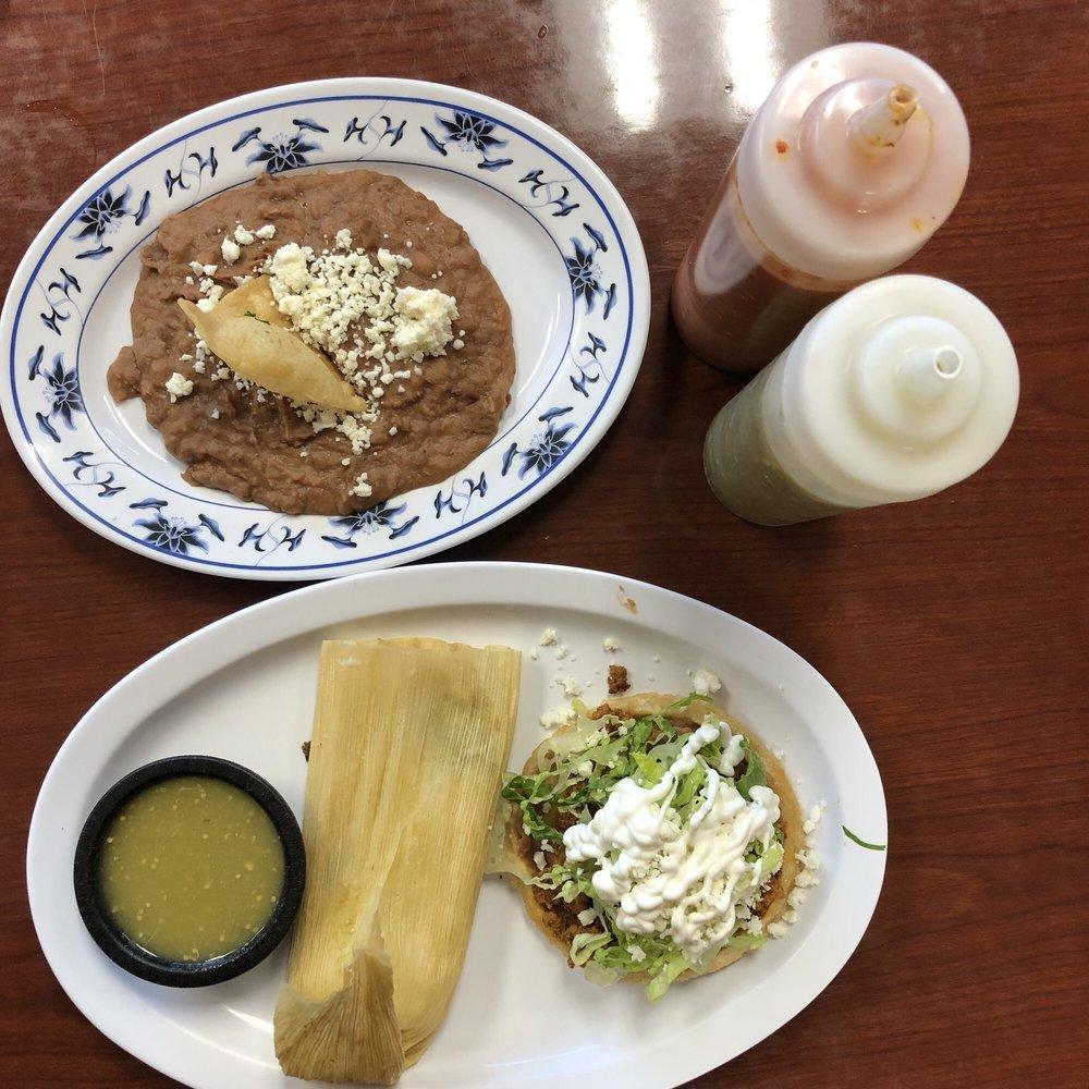 Sopes · Handmade thick tortilla, covered with refried beans, the meat of choice, lettuce, cheese and sour cream.