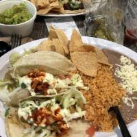 Three Fried Shrimp Tacos Combo · Rice beans, salad and tortillas.