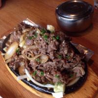 Beef Bulgogi · Thin sliced and marinated beef sauteed with onions.