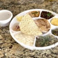 The Signature Gujarati Thali · We are unable to swap items in Thali. 