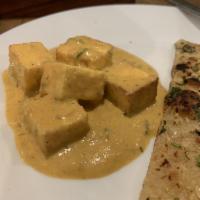 Paneer Butter Masala · Lightly fried paneer simmered in mild tomato cream sauce.