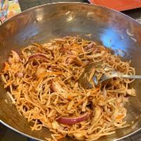 Chinese Bhel · Crispy noodles, cabbage, carrots, and onions tossed in a spicy sauce.