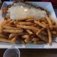 Chicken Fried Steak · Hand-battered & tender smothered in homemade creamy gravy with your choice of 2 sides