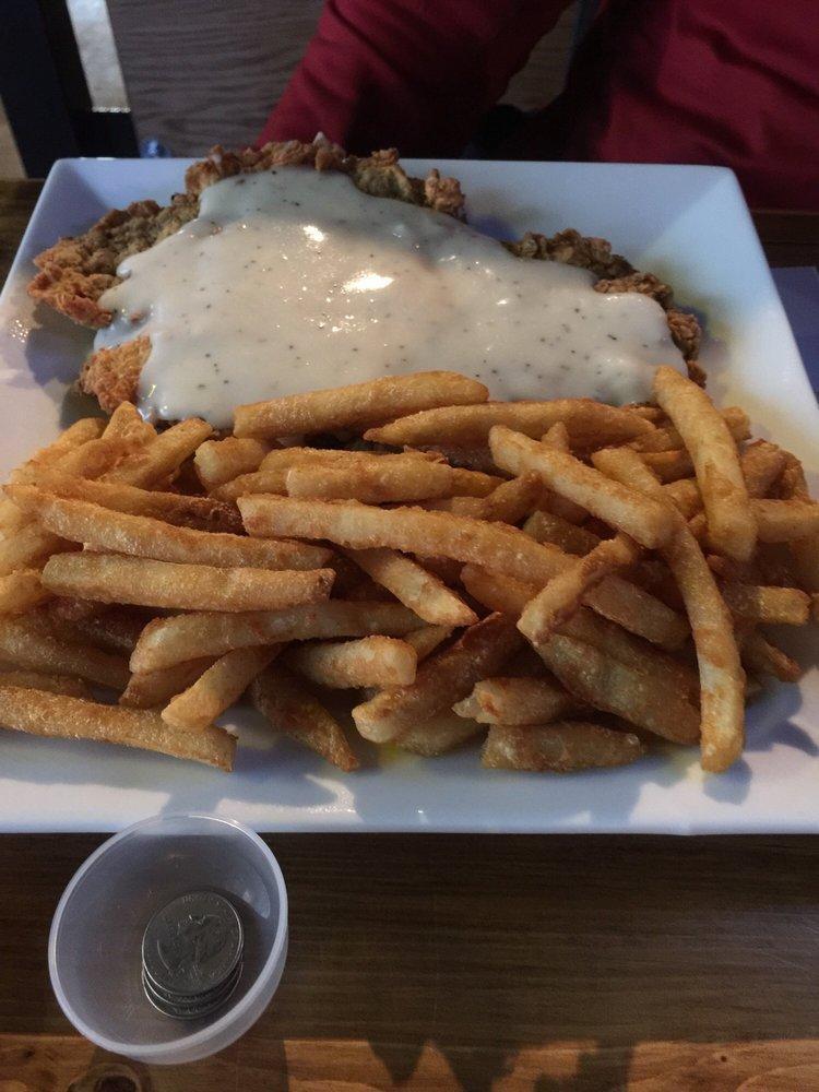 Chicken Fried Steak · Hand-battered & tender smothered in homemade creamy gravy with your choice of 2 sides