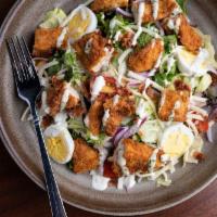 Southern Fried Chicken Salad · Iceberg ＆ romaine lettuce, grape tomatoes, bacon, cheddar, red onions, hard boiled egg, hone...