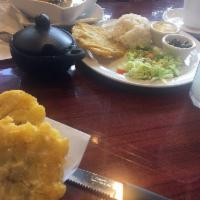 Ajiaco · Checkmark. Soup with chicken, potato, peat, and corn.