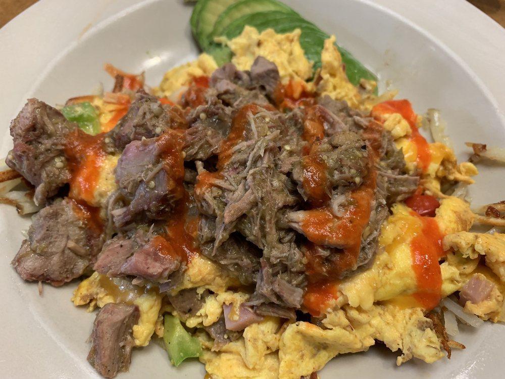 Border Bowl · Scrambled eggs, bacon, sausage, ham, chorizo, onions, green peppers, jalapenos, hash browns, cheddar, pork green chili and hot sauce. Add avocado for an additional charge.