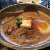 Spicy Miso Ramen · Spicy miso flavored pork bone stock soup topped with chashu, boiled egg, scallions, corn, ba...