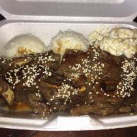 Kalbi Ribs · Korean short beef ribs sliced thin marinated in kalbi sauce. Served with 2 scoops of rice, m...