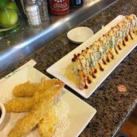 Crunchy Roll · In: Shrimp tempura, crab and avocado. Top: Crunchies, sp mayo and eel sauce.