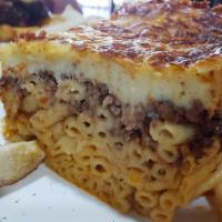 Pastitsio · Macaroni, ground beef, graviera cheese, and bechamel sauce.