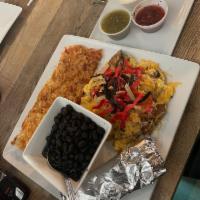 Migas · Scrambled eggs, fresh jalapenos, tomatoes and onions. Topped with Jack cheese, tortilla stri...