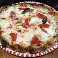Margherita Pizza · Imported mozzarella, San Marzano tomato sauce and fresh basil.