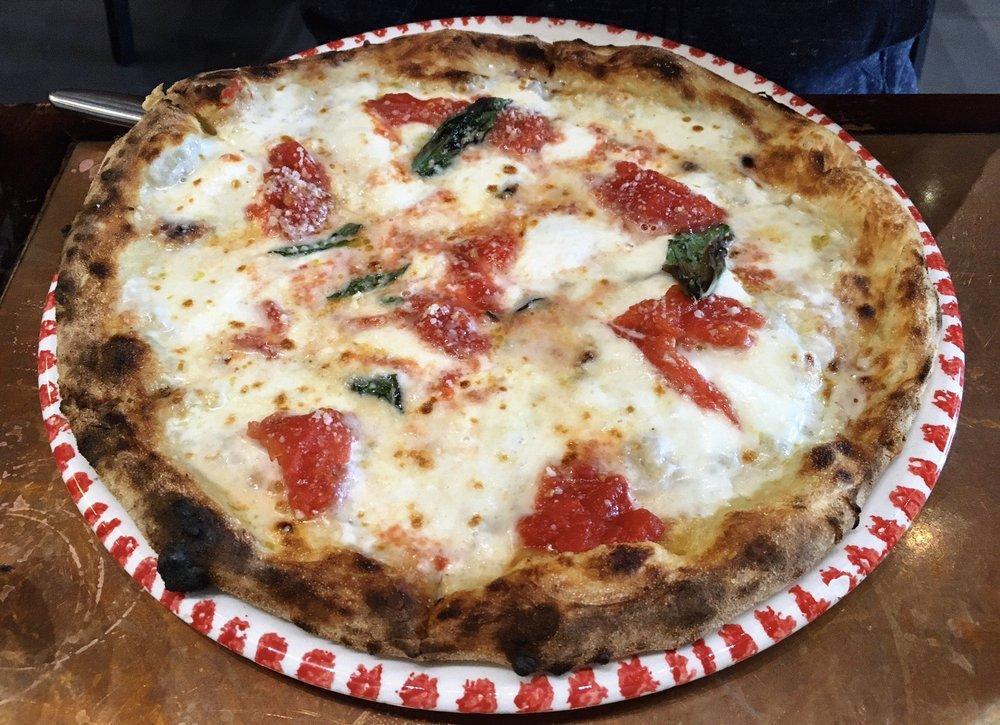 Margherita Pizza · Imported mozzarella, San Marzano tomato sauce and fresh basil.