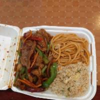 Mongolian Beef · Tender beef strips with sliced bell peppers, onions, and carrot stir fried in a spicy Mongol...