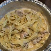 Fettuccine Alfredo · Creamy white wine sauce served over fettuccine. Add chicken for an additional charge.