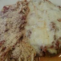 Veal Parmigiana · Lightly breaded and topped with marinara and mozzarella cheese served over spaghetti.