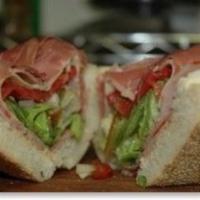 The Real Deal Italian · Imported capicola ham, Genoa salami, provolone. and pepper ham on a sub roll with olive oil,...