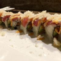 Tiger Roll · Raw. Spicy tuna and avocado wrapped inside out with tuna, white tuna, salmon crunch on top a...