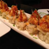 Volcano Roll · Raw. Shrimp tempura, red hot sauce and avocado wrapped inside out, deep fried with crunchy s...