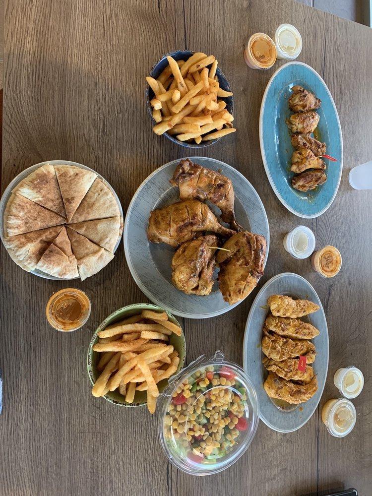 Sharing Platter · Full chicken, 5 wings, 5 strips, 1 mixed salad, 2 fries and 2 grilled pitas.