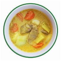 Yellow Curry · Yellow curry paste with coconut milk, potatoes, onion, carrot.