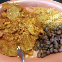 Chilaquiles · Tortilla chips with scramble eggs and cheese drenched with your choice of either red or gree...