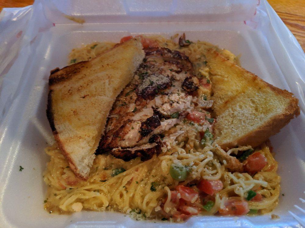 Blackened Chicken Pasta · Blackened chicken breast served with your choice of cream sauce or olive oil on a bed of angel hair pasta with tomatoes and scallions.
