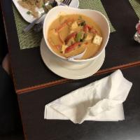 Panang Curry · Curry with coconut milk, bell pepper and fresh basil leaves.