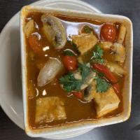 Tom Yum Soup · Thai hot and sour lime, lemongrass broth with galangal, mushrooms, tomato, lime leaves, onio...