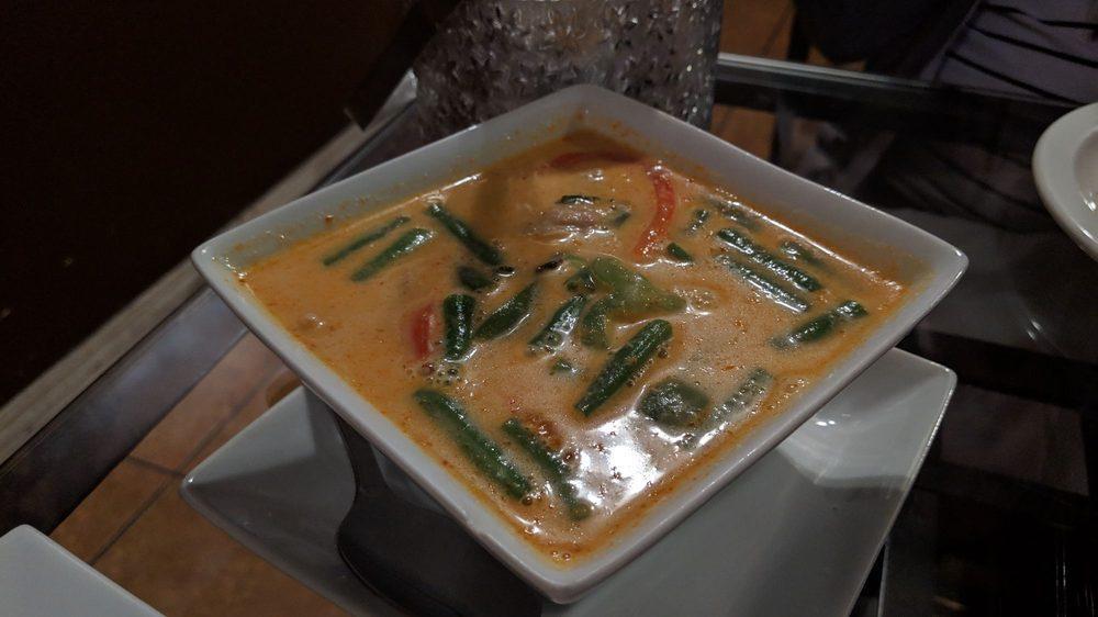 Panang Curry · Bell pepper, Green bean and Fresh Basil in Panang 
curry sauce topped with Kaffir lime leaves
