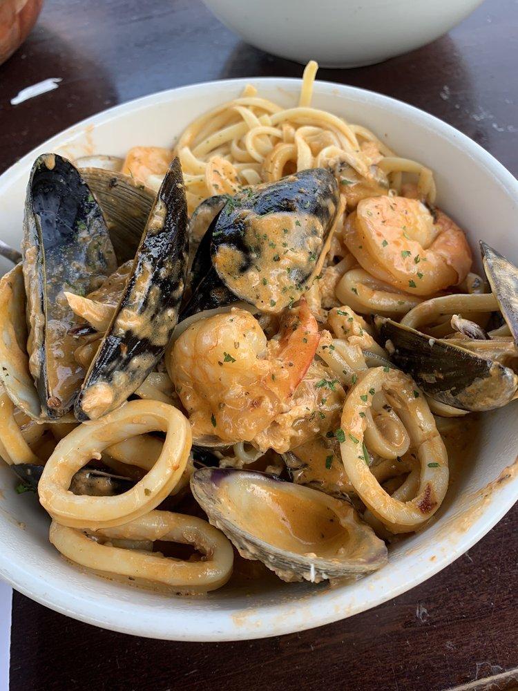 Seafood Fiesta · Shrimp, scallops, clams, mussels, calamari, crab meat and linguini simmered in your choice of our pink cream and plum tomato fiesta sauce or a spicy garlic and tomato fra diavolo broth.