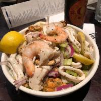 Seafood Salad · Scallops, shrimp, mussels, calamari, sliced celery and red onions marinated in olive oil, le...