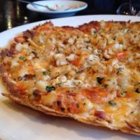 Biggie's Clam Pizza · Mozzarella, ricotta cheese, chopped clams, onions, herbs and garlic.