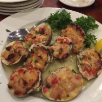 Clams Casino · Eight clams baked with onions, peppers, and bacon breading mixture.