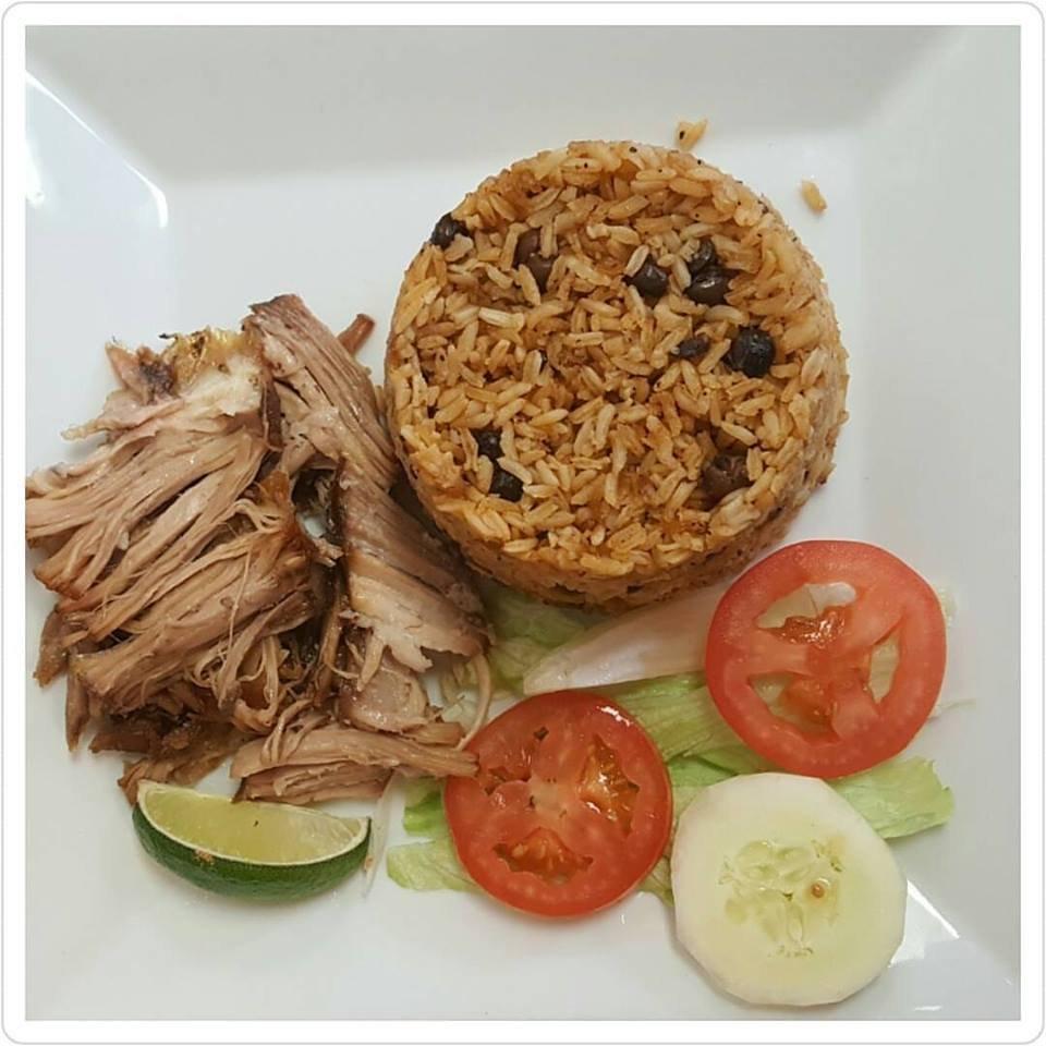 Pernil · Roasted pork. Choice of side: White Rice and Beans, Fried Plantains, Sweet Plantains, French Fries or Steamed Vegetables